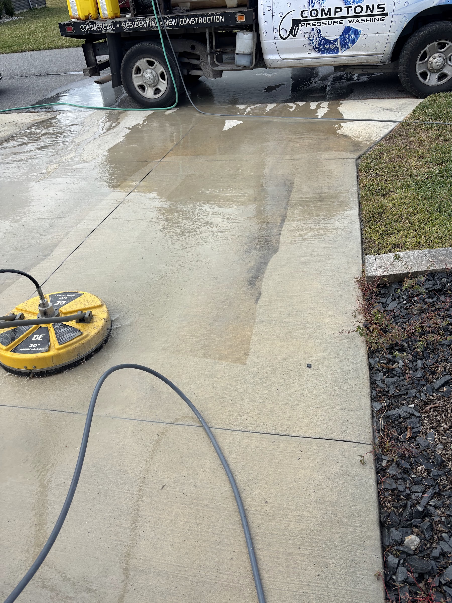 Compton Services truck with commercial surface cleaner mid-job